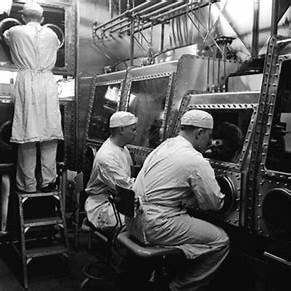 Researchers working with Class III biological safety cabinets at the U.S. Biological Warfare Laboratories at Camp Detrick, Maryland, in the 1940s.